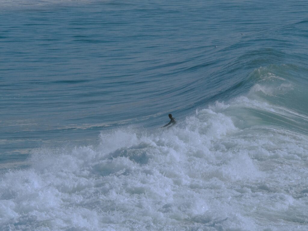 Catch the thrill of surfing in Taghazout's majestic waves. Ideal for adventure and travel seekers.